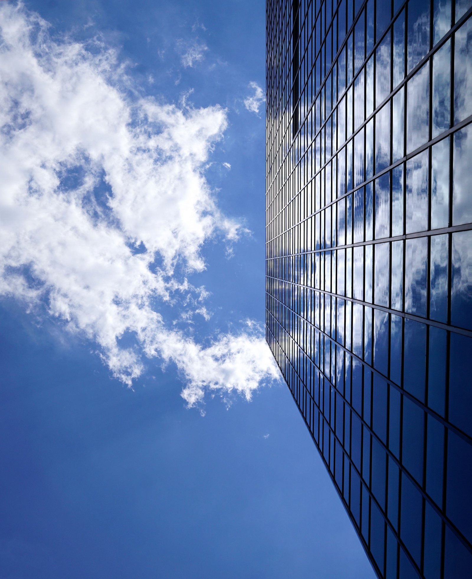 Corporate architecture - looking upward through a glass tower